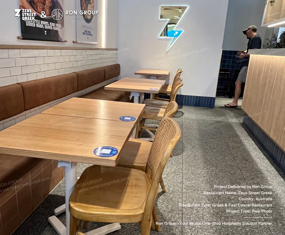 Zeus Street Greek wooden tables and woven chairs