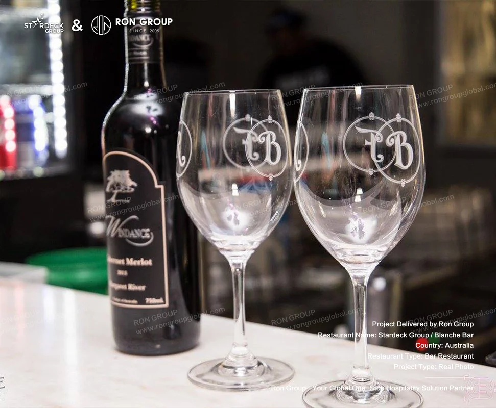 Blanche Bar RonGroup-Blanche_Bar-Wine_Bottle_And_Two_Glasses.webp
