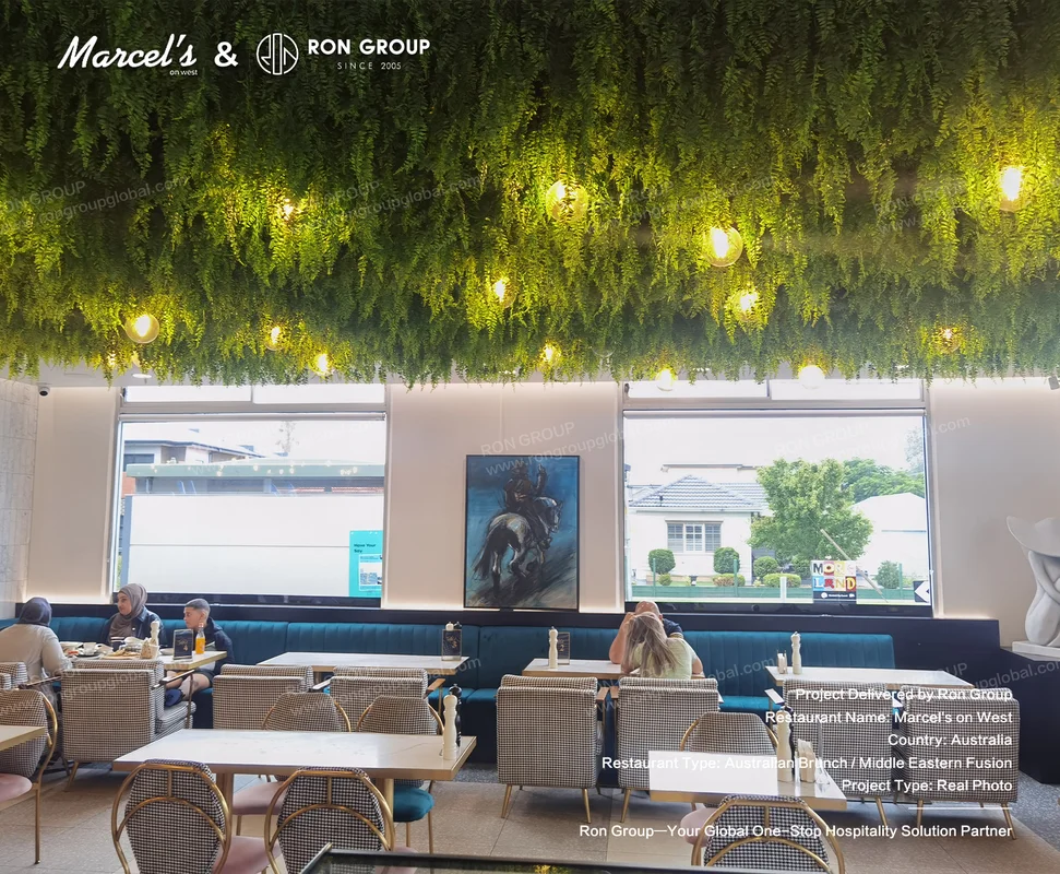 Brunch On West RonGroup-Brunch_On_West-Green_Foliage_Ceiling_With_Lights.webp