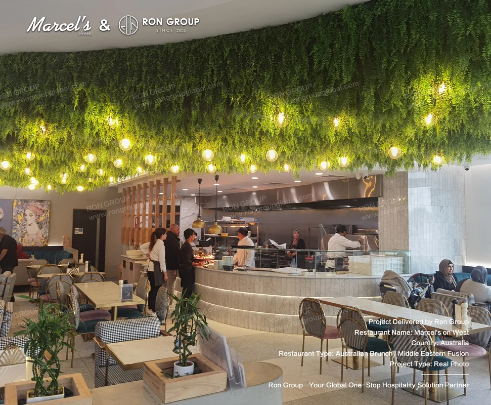 Brunch On West RonGroup-Brunch_On_West-Green_Leaf_Ceiling_With_Lights.webp