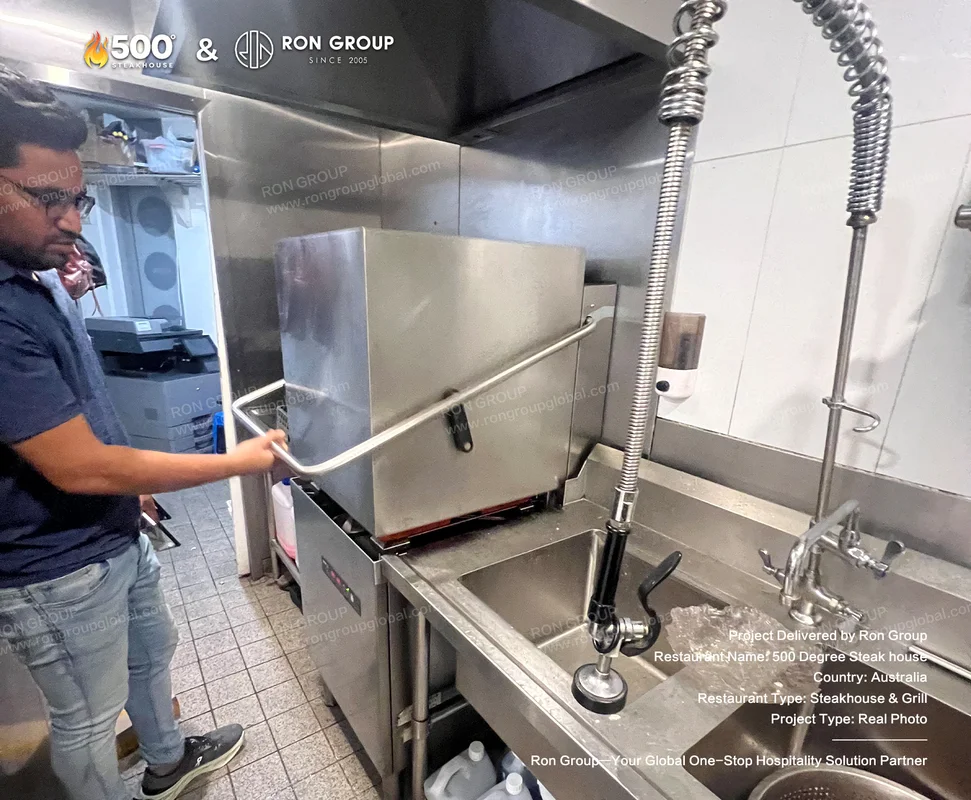 Stainless steel kitchen equipment and work zones at 500 Degrees Steakhouse