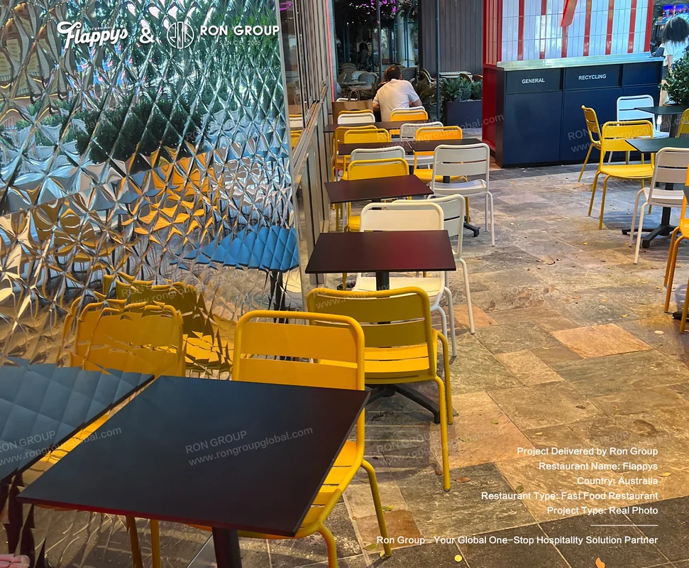 Flappys outdoor dining with yellow chairs