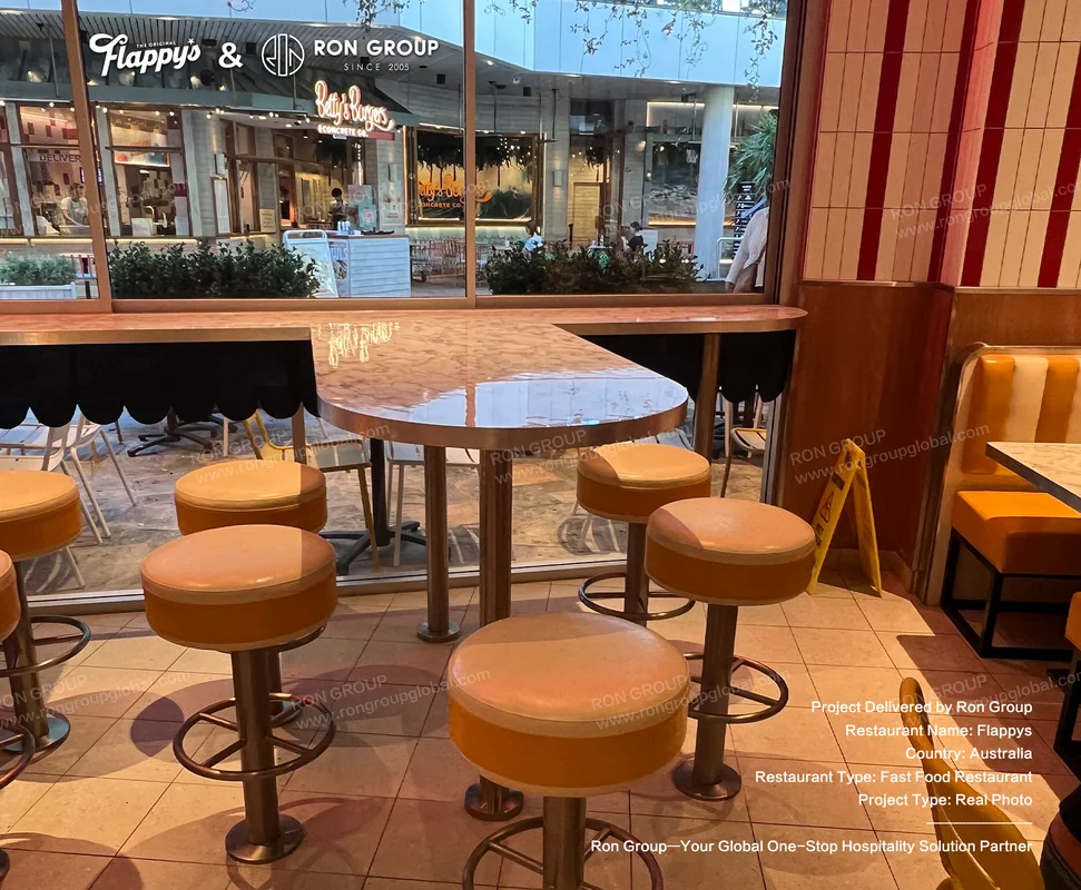 Flappys bar stools and marble-top tables