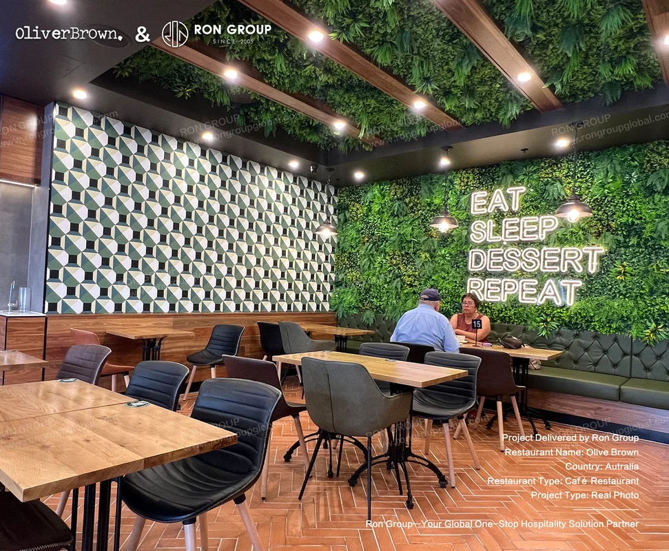 Oliver Brown cafe dining corner with greenery