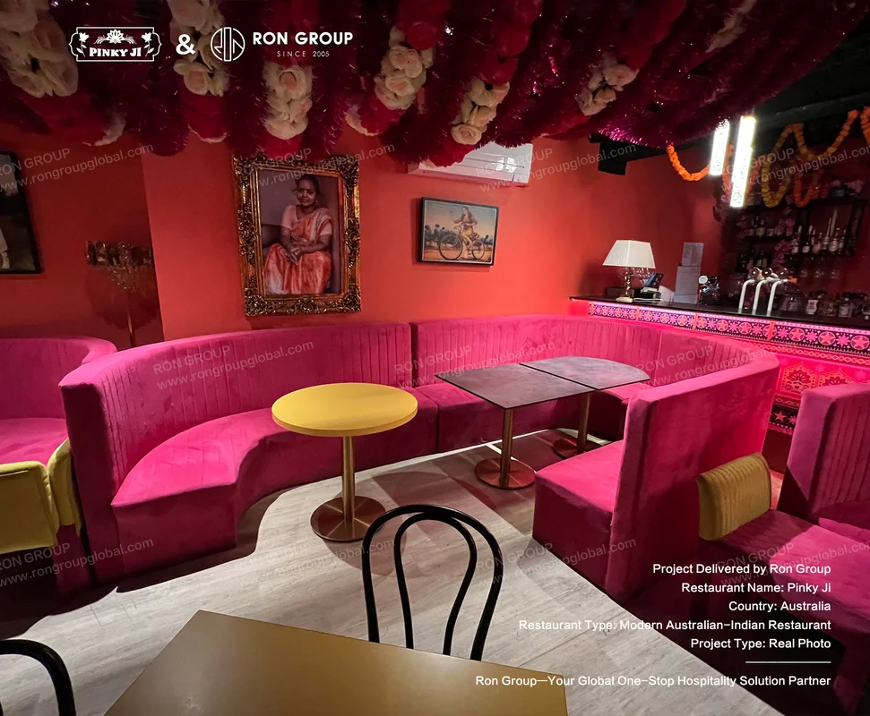 Pinky Ji pink velvet booths with floral ceiling