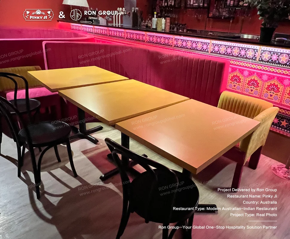 Pinky Ji wooden tables and black metal chairs