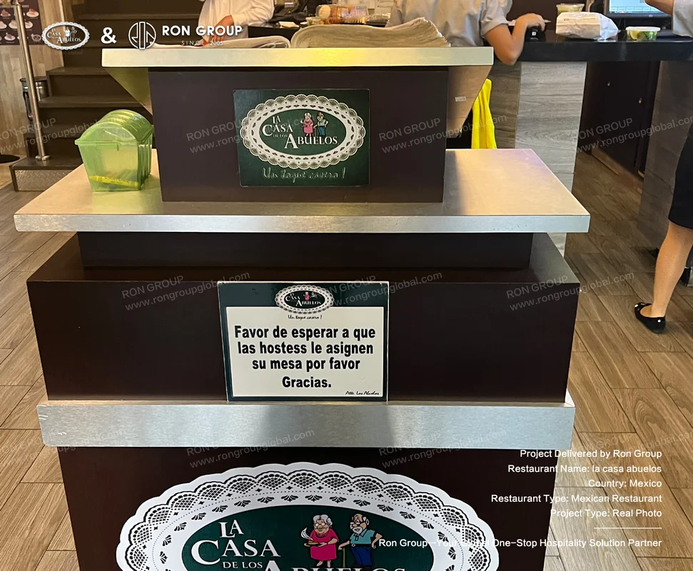 La Casa Abuelos RonGroup-A_Casa_Abuelos-Restaurant_Reception_Counter.webp