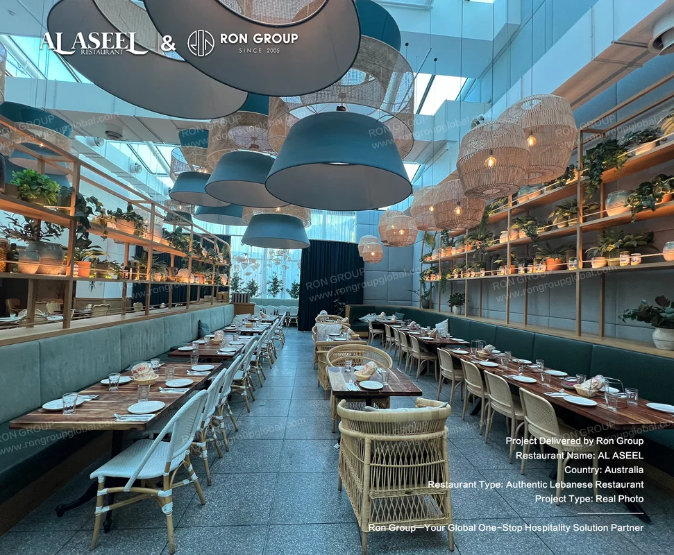 Teal banquette booths wooden tables and blue woven pendant lamps at Al Aseel