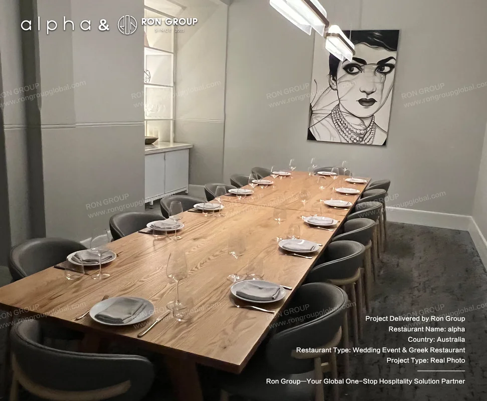 Alpha private dining room with long wooden banquet table and upholstered chairs