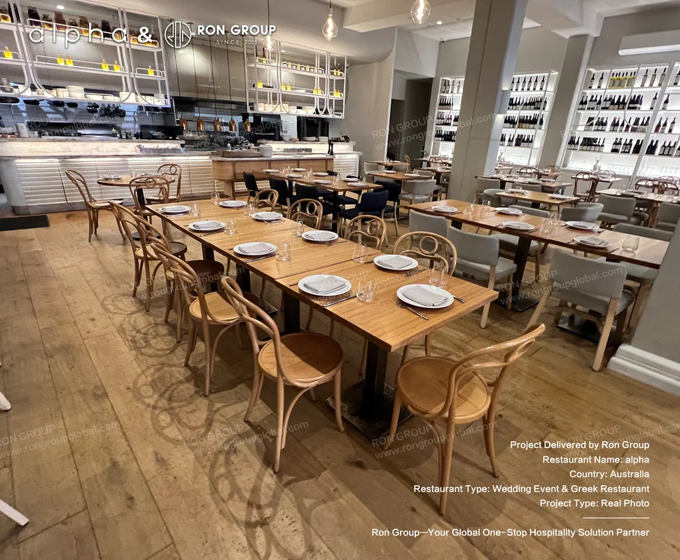 Alpha Sydney main dining room with solid wood tables and illuminated wine display