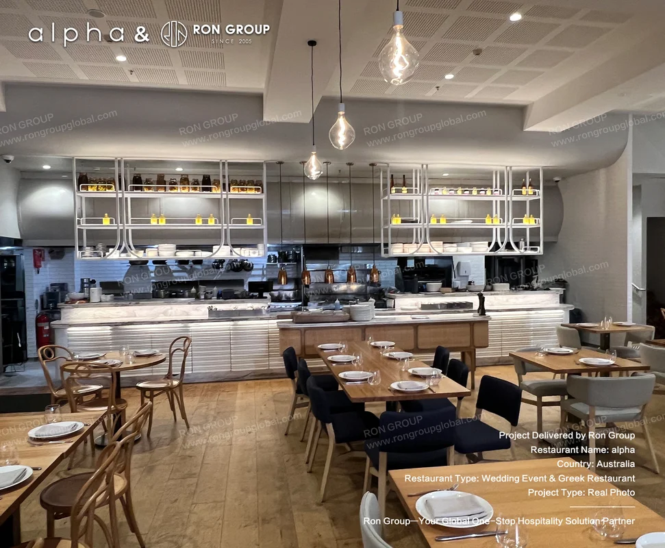 Alpha open kitchen dining area with wooden tables and industrial pendant lights