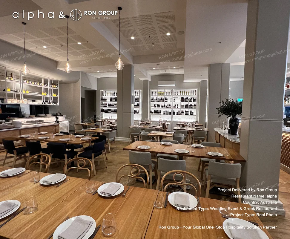 Alpha dining zone with warm wooden tables grey chairs and pendant lighting
