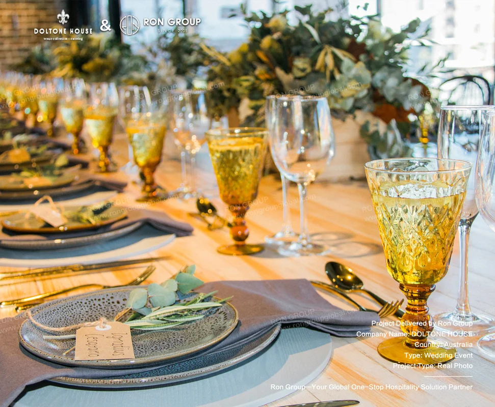 Doltone House wedding place setting with textured grey stoneware plate and amber glassware