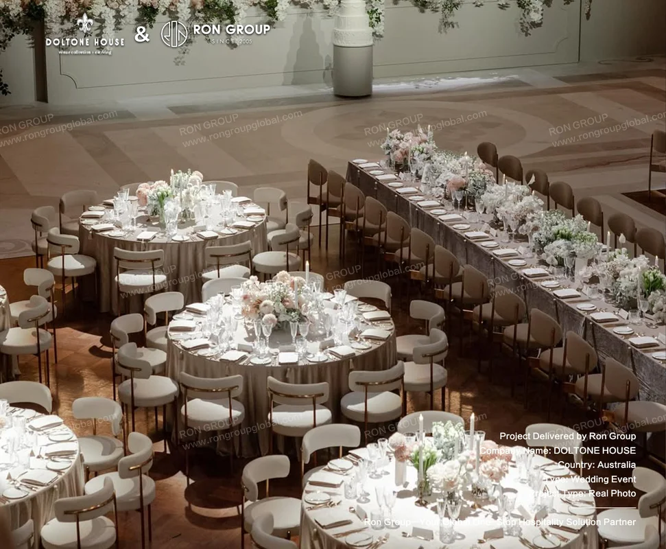 Mixed round and long wedding banquet tables with neutral upholstered chairs at Doltone House