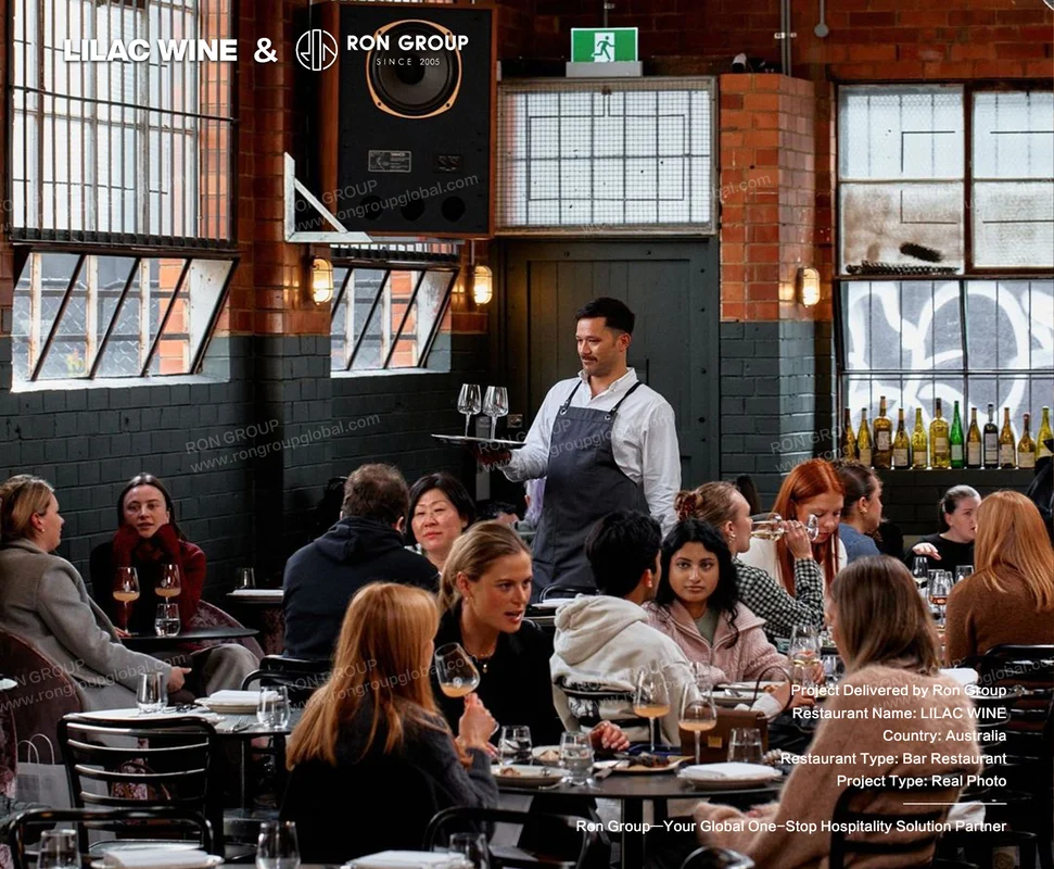 Lilac Wine dining room with exposed brick walls industrial windows and bentwood seating