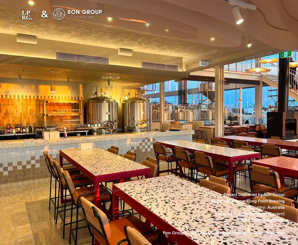 Long Point Brewing taproom with red terrazzo tables checkered tile bar and brewing tanks