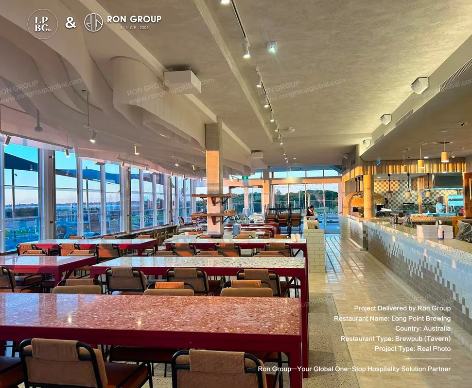 Long Point Brewing main dining floor with red tables beige chairs and checkered bar