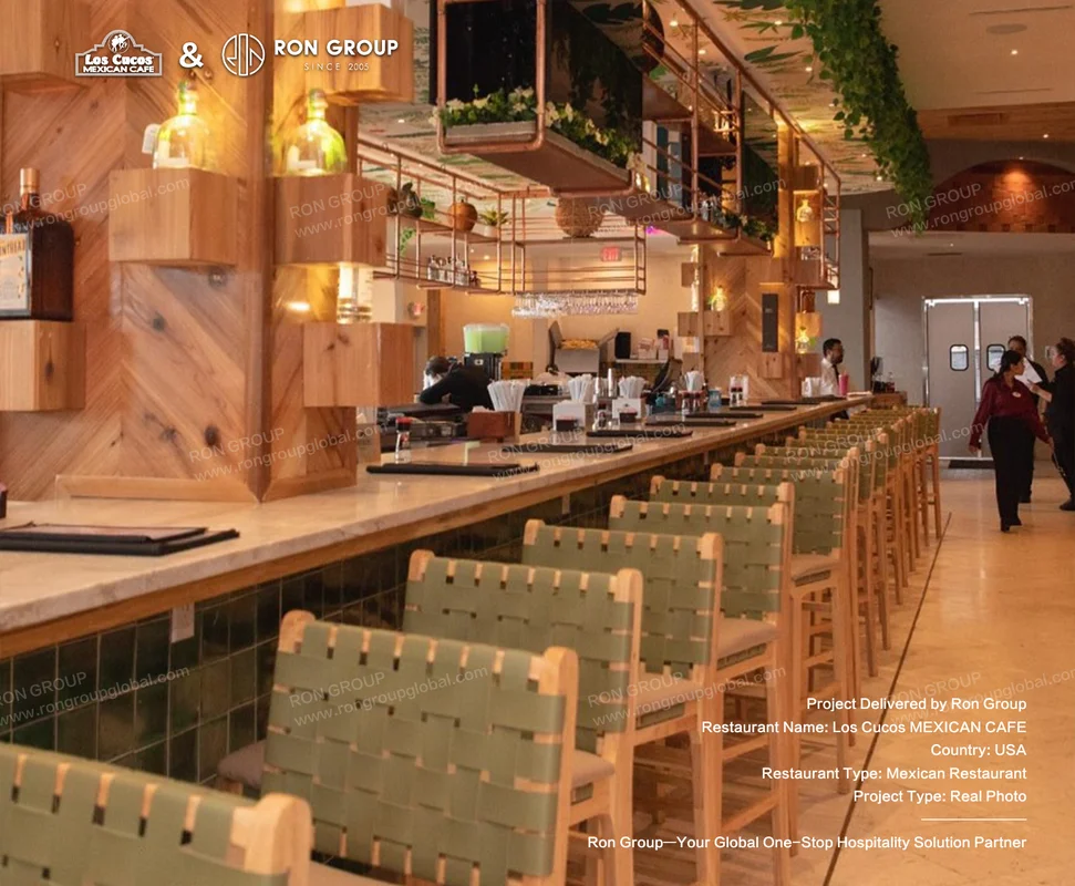 Los Cucos Mexican Cafe RonGroup-Los_Cucos_Mexican_Cafe-Wooden_Bar_With_Green_Chairs.webp