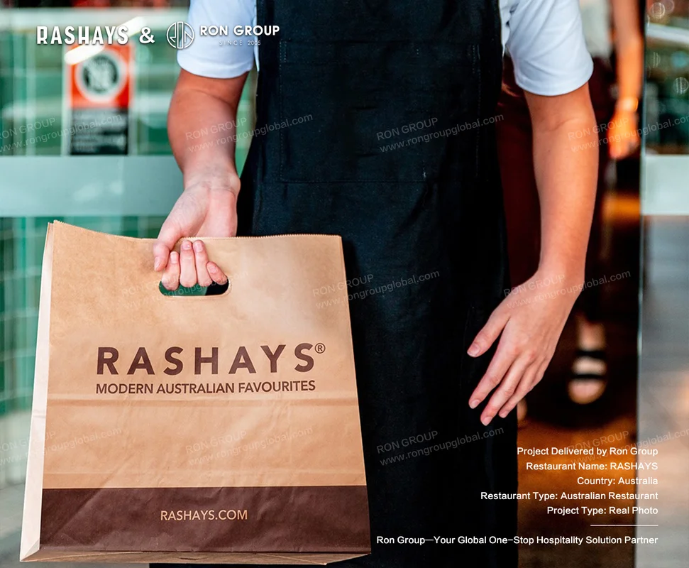 Rashays RonGroup-Rashays-Person_Holding_Paper_Bag.webp