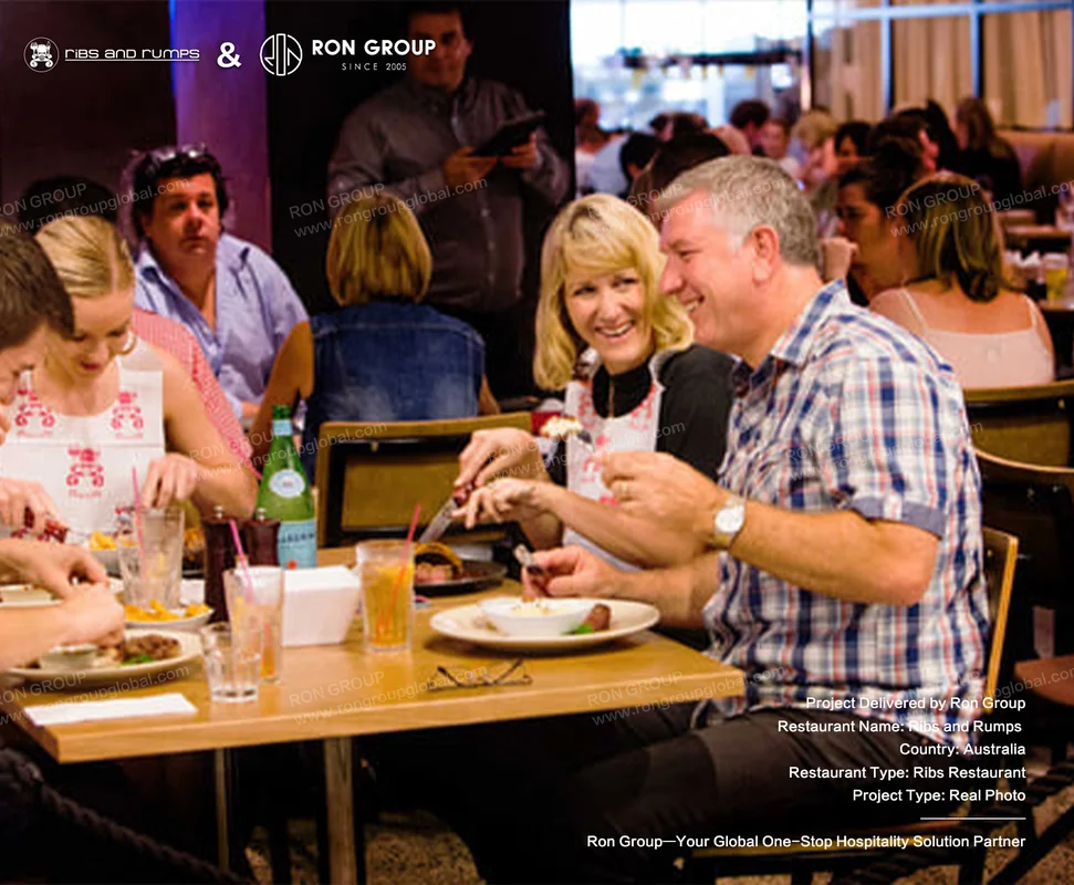 Guests enjoying shared meals and drinks around custom solid wood dining tables