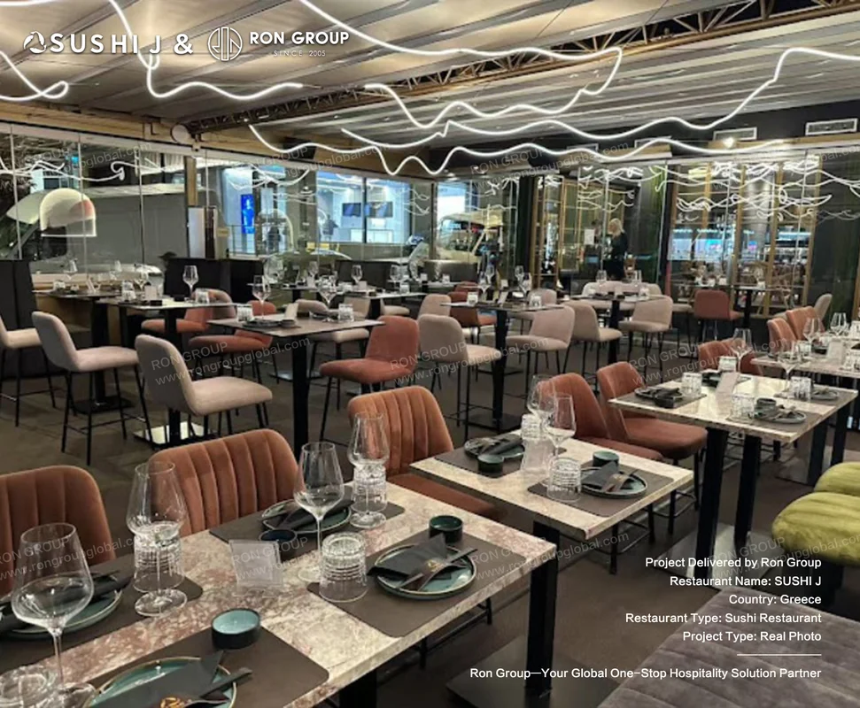 Sushi J marble dining tables warm velvet chairs and sculptural wave ceiling light