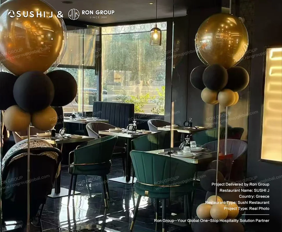 Sushi J main dining room with dark green velvet chairs and natural window light