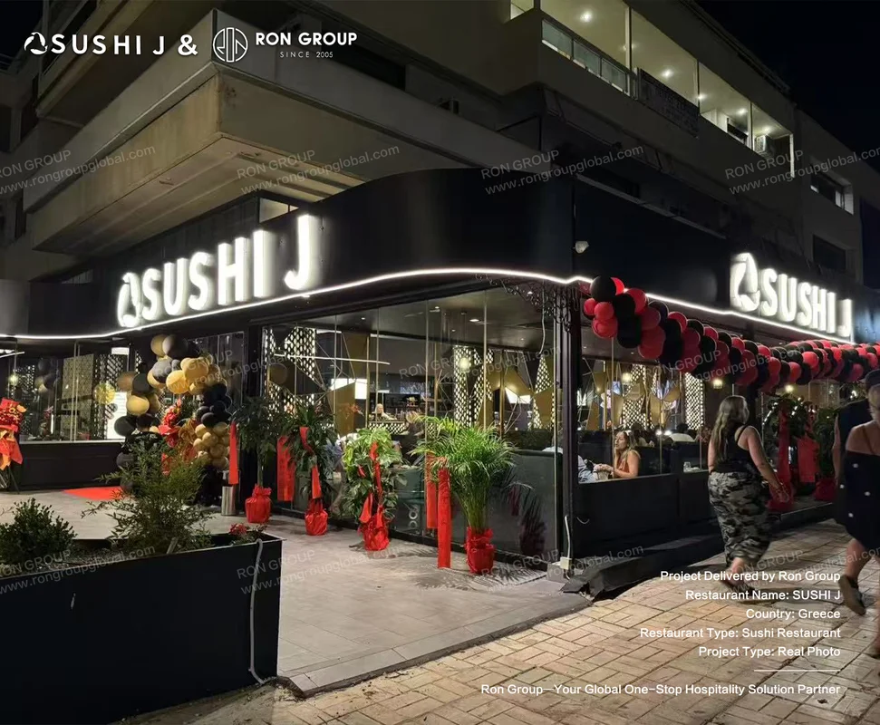 Sushi J illuminated exterior facade and dining room glow at night