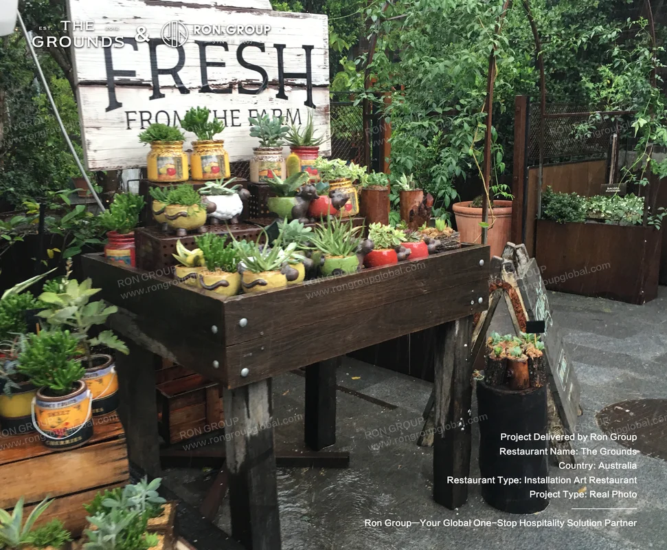 Rustic wooden display planter showcase with potted succulents and Fresh From The Farm signage at Sydney Garden Restaurant