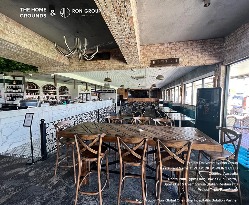 Exposed brick dining room with solid timber tables and marble wine bar at The Home Grounds