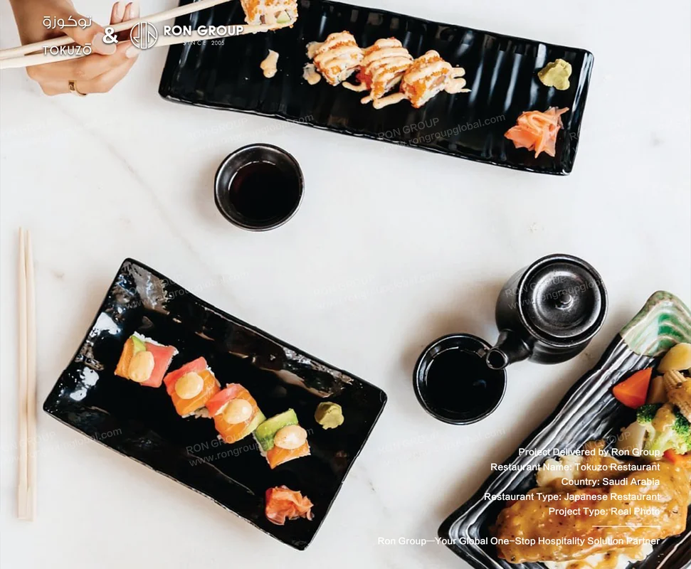Tokuzo Restaurant RonGroup-Tokuzo_Restaurant-Sushi_On_Black_Plates.webp