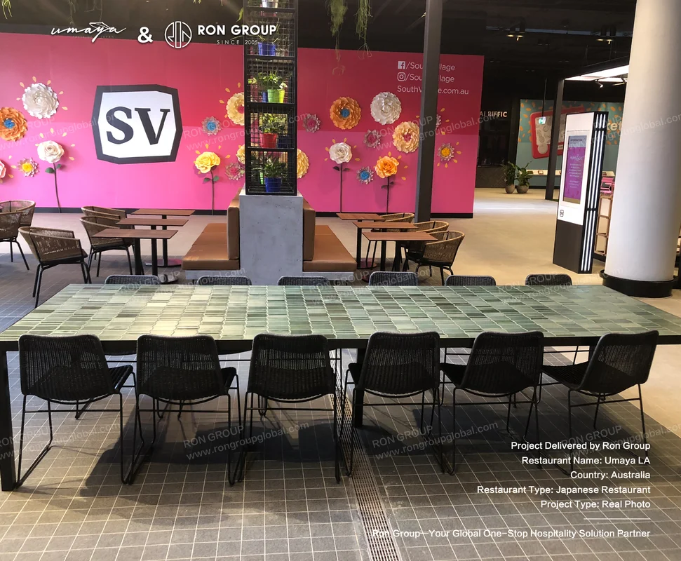 UMAYA green tile communal dining table with woven chairs