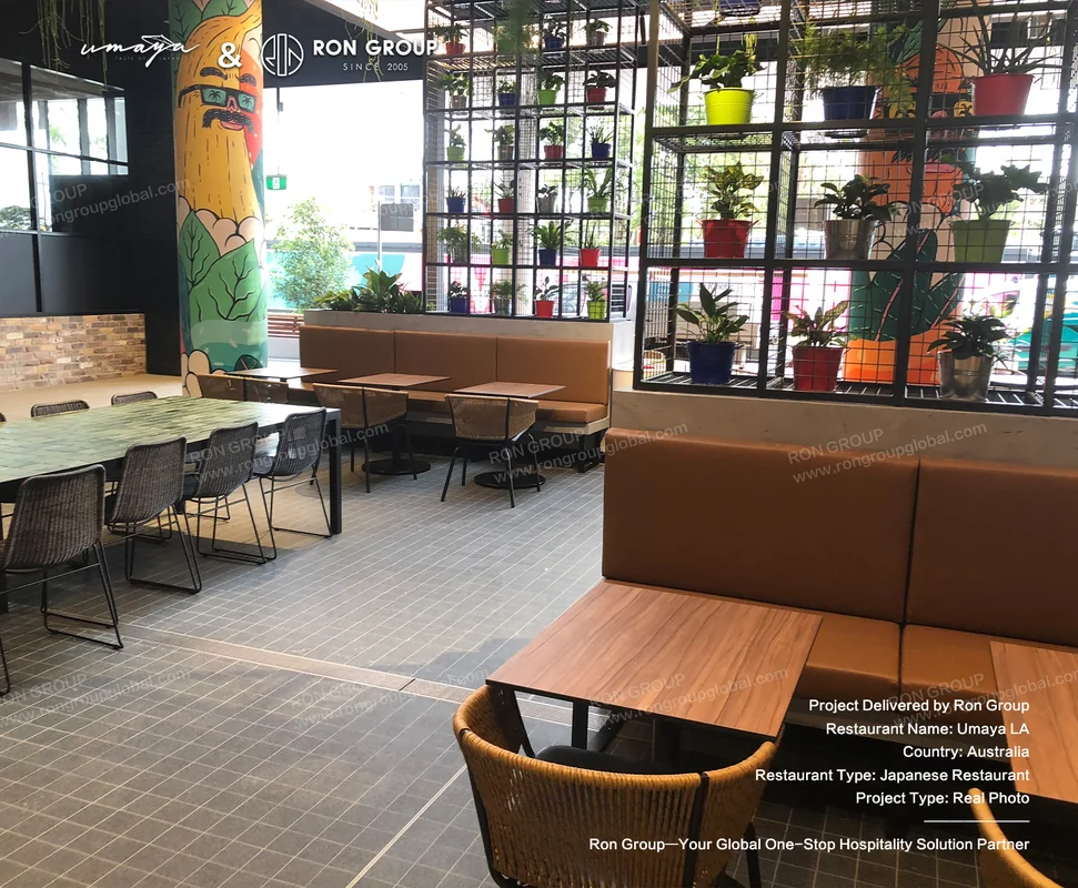 UMAYA dining area with natural wood tables and woven chairs