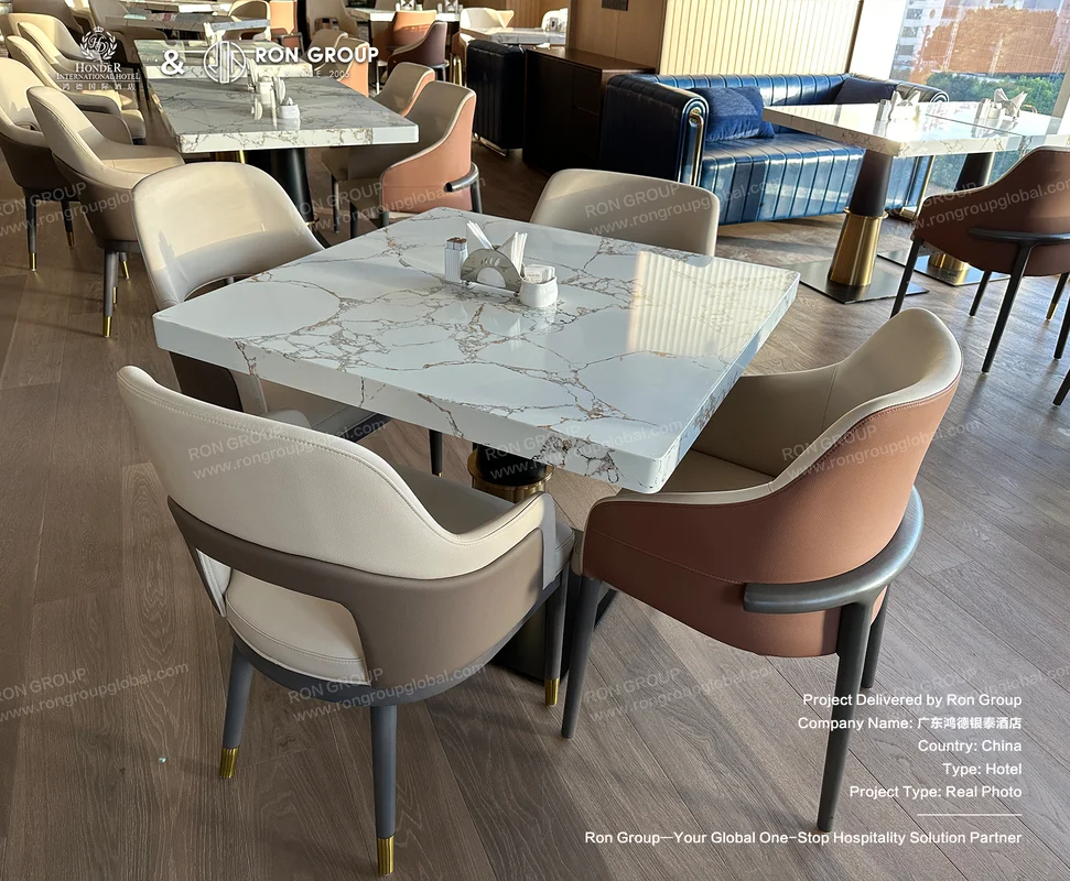Honder International Hotel Marble Top Dining Tables on Dark Wood Flooring