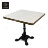 A rectangular black stone tabletop with a dark brown central base.