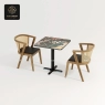 A square mosaic table with a black base and two rattan chairs.