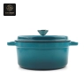 A blue enamel cast iron dutch oven with a lid on, shown from a front view.