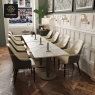Multiple beige high-back armchairs at tables in a modern dining room setting.