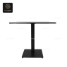 A white stone tabletop with rounded corners and a gold central base.