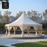 Luxury outdoor setting featuring a large aluminum pergola shading two comfortable lounge chairs in a beautifully landscaped garden.