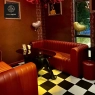 RON GROUP - Restaurant interior with red leather furniture