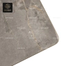 A round gray stone tabletop with a polished gold central base.