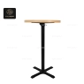 A round, dark-wood top bar table with a polished silver central base.