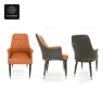 Front, side, and back views of a two-tone leatherette armchair.