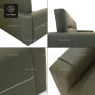 Close-up details of the dark green modular sofa's stitching and texture.