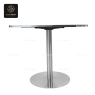A square table with a mosaic top and a shiny silver, single-column base.