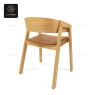A single Nordic solid wood chair with a light brown cushion, viewed from the back.