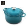 A close-up of the handle and lid of a blue enamel cast iron dutch oven.