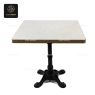 A rectangular white marble tabletop with a black central base.
