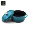 A blue enamel cast iron dutch oven with its lid propped open, showing the black interior.