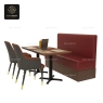 Two armchairs paired with a table and a red booth seating.